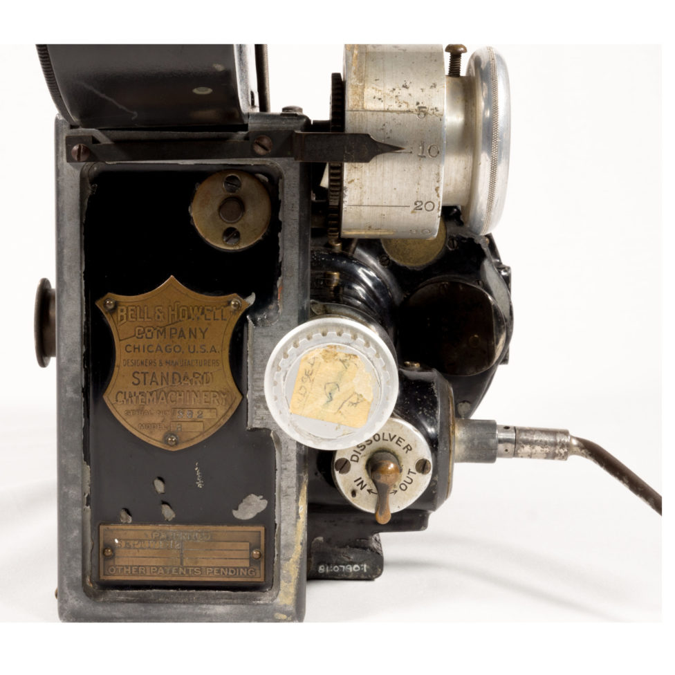 The plaque reads, “Bell & Howell Company, Chicago, U.S.A. Designers and Manufacturers. Standard Cinemachinery, serial number 382, model B.”