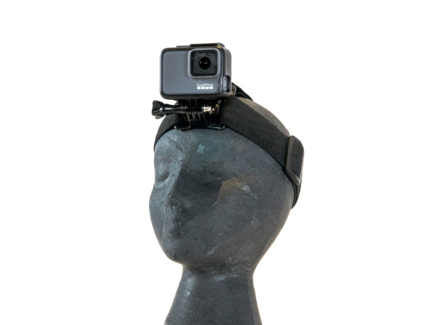 A mannequin wears a camera mounting strap. The GoPro is mounted at forehead level.