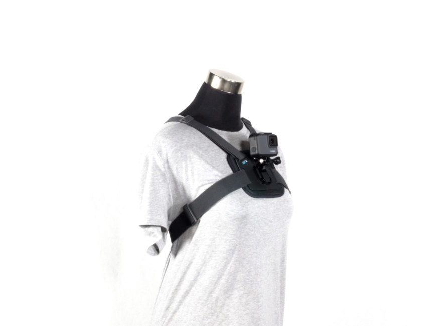 A mannequin wears a GoPro mounted on a harness at chest level.